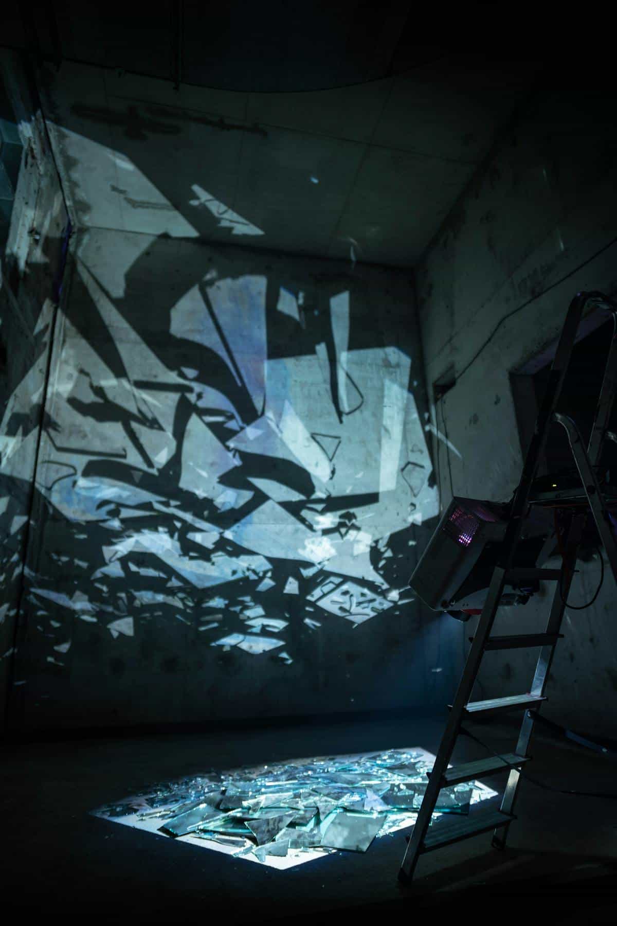 Abstract broken glass reflections symbolising fragmented self-image in broken mirror dreams Abstract broken glass with light reflections in a dark room evoking shattered self-image in broken mirror dreams