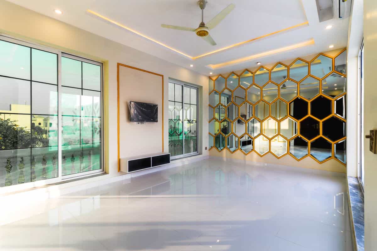 Interior with multiple mirrors compared with a single large mirror for a dining room