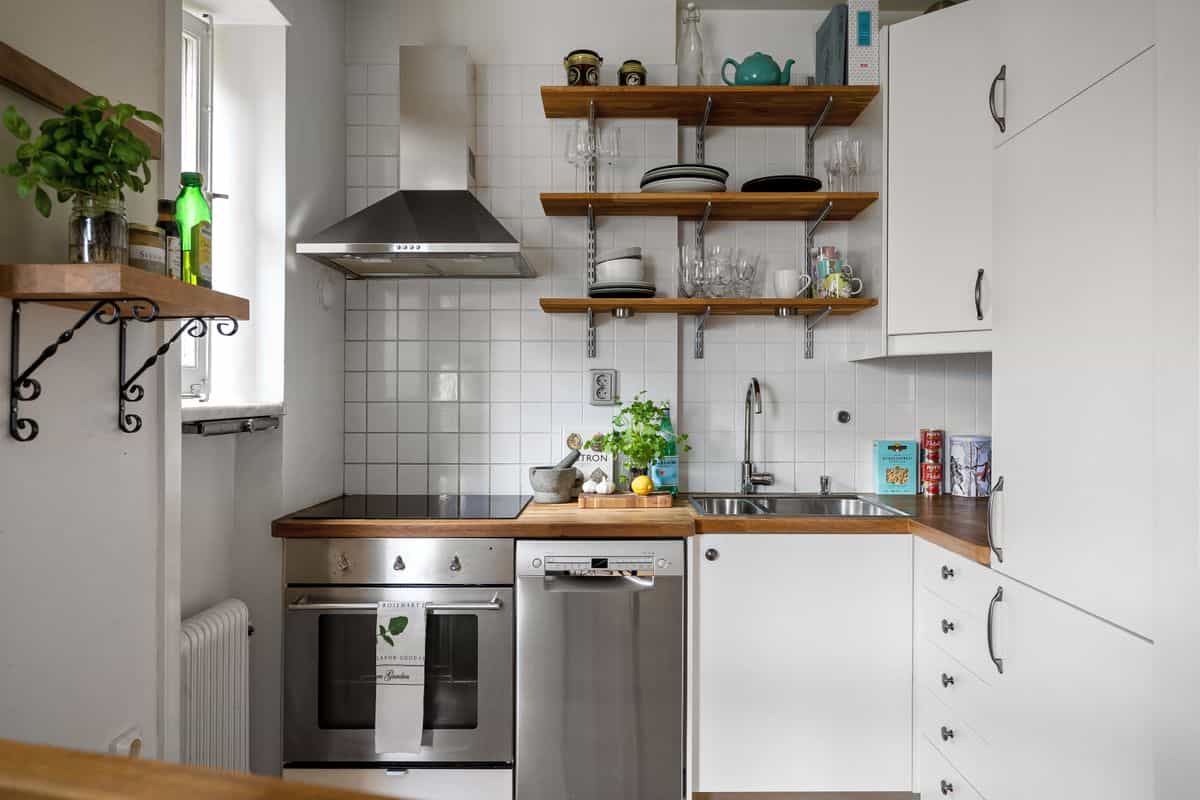Vertical open shelving illustrating feng shui decluttering and storage in a small apartment Small space with open vertical shelving for storage, illustrating feng shui decluttering in a studio apartment