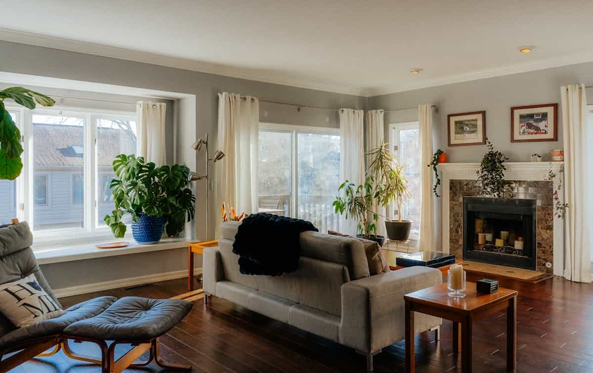 Calm home interior evoking Vastu and mirror placement Bright orderly home interior where north–east light and open space echo Vastu-friendly mirror use