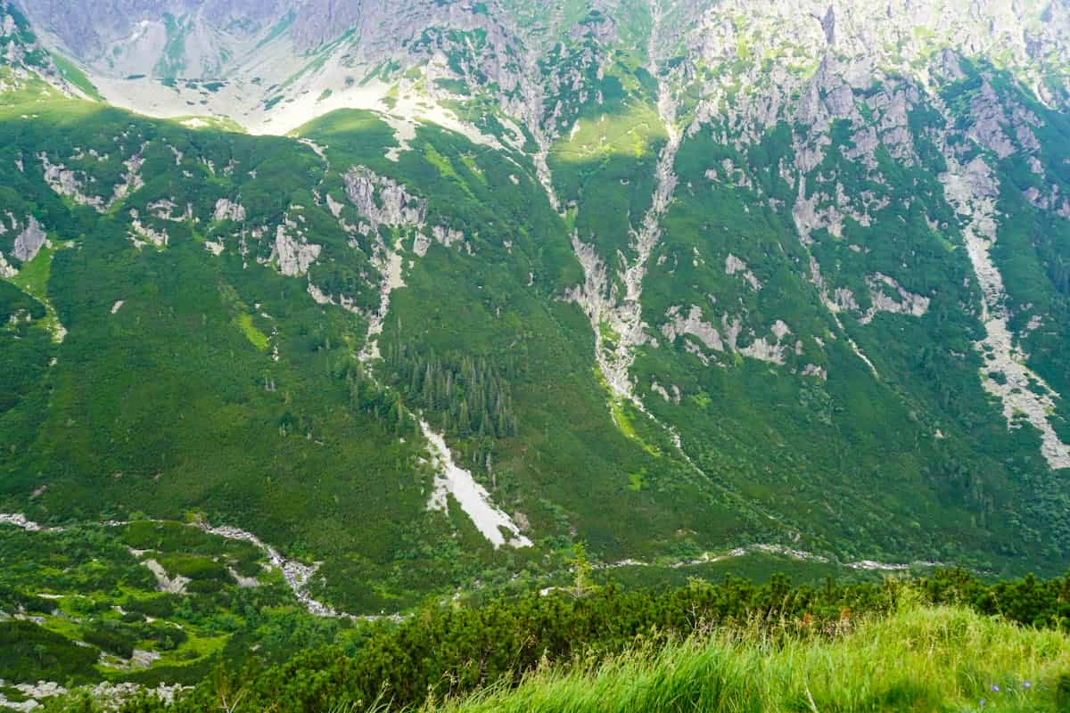 Majestic mountain valley with layered ridges suggesting echo soundscape and remote call