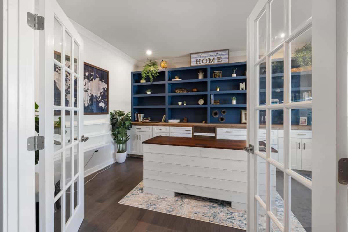 Stylish home office with blue shelves and a white desk, illustrating feng shui five elements and colors