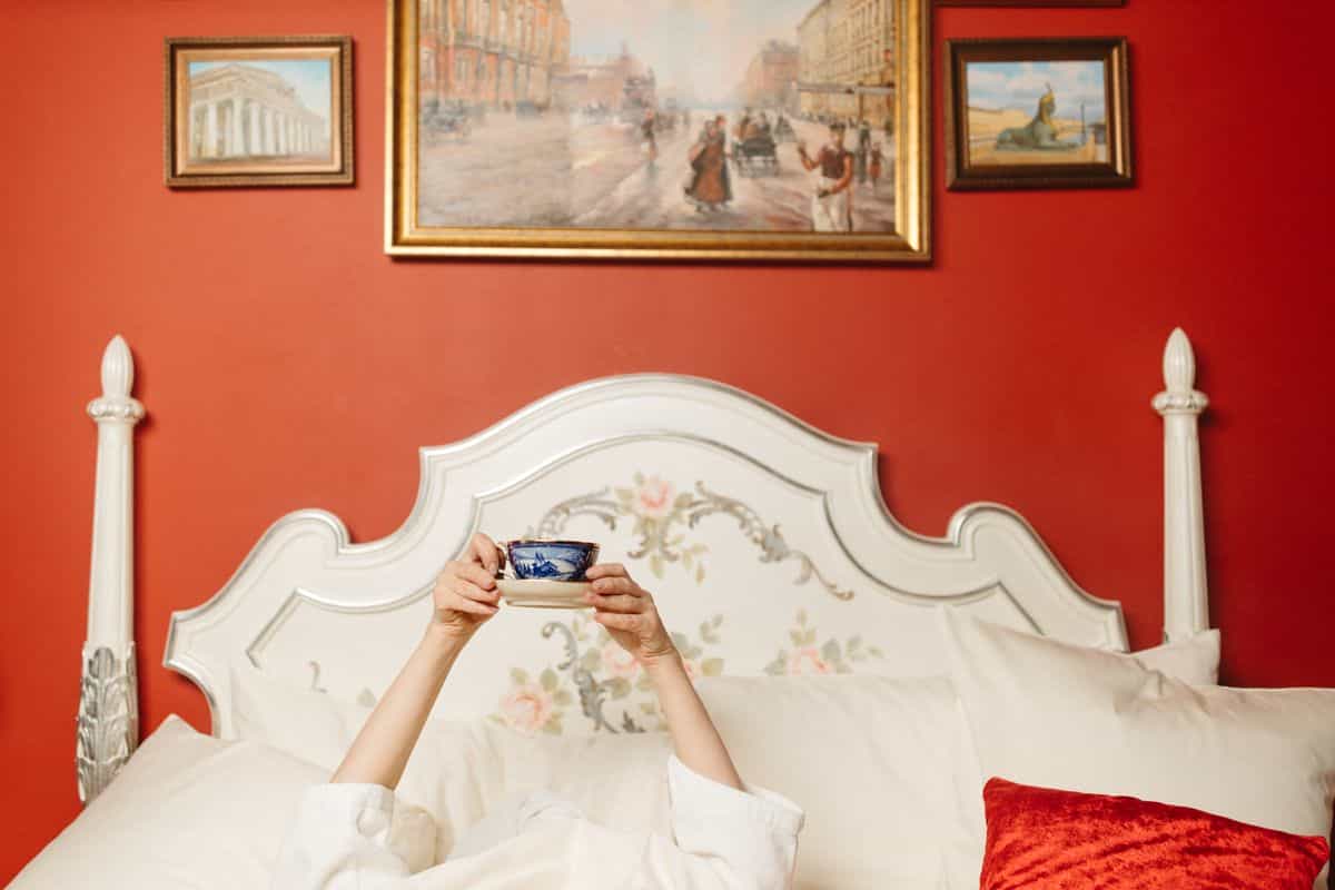 Bedroom with bold red walls illustrating the high-energy feng shui colors to use only as accents Bedroom with bold red walls and framed art, illustrating high-energy feng shui colors to use sparingly