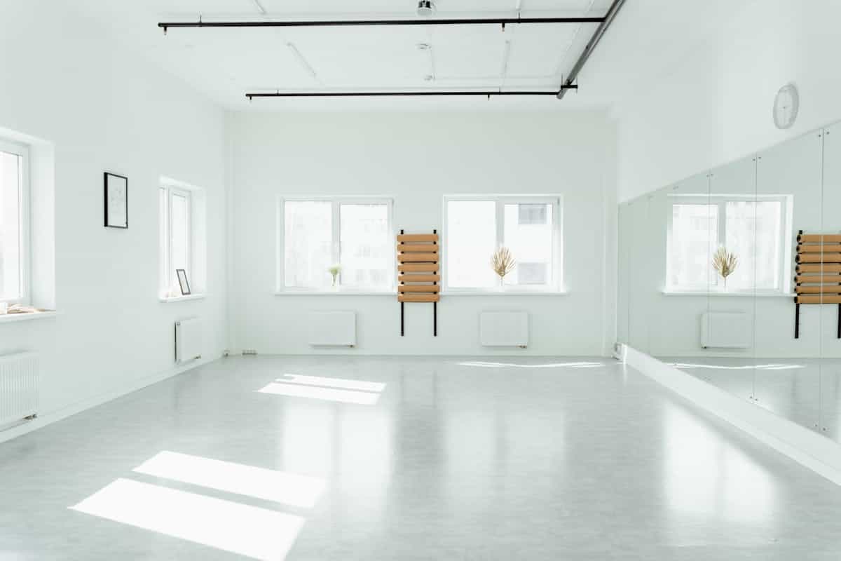 Minimalist modern round mirror on wall with bright natural window light