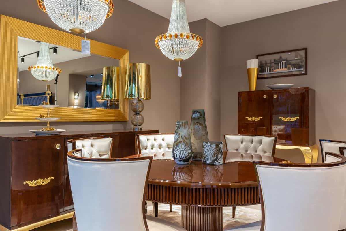 Round dining table reflected in a nearby mirror, illustrating the feng shui dining room mirror tradition