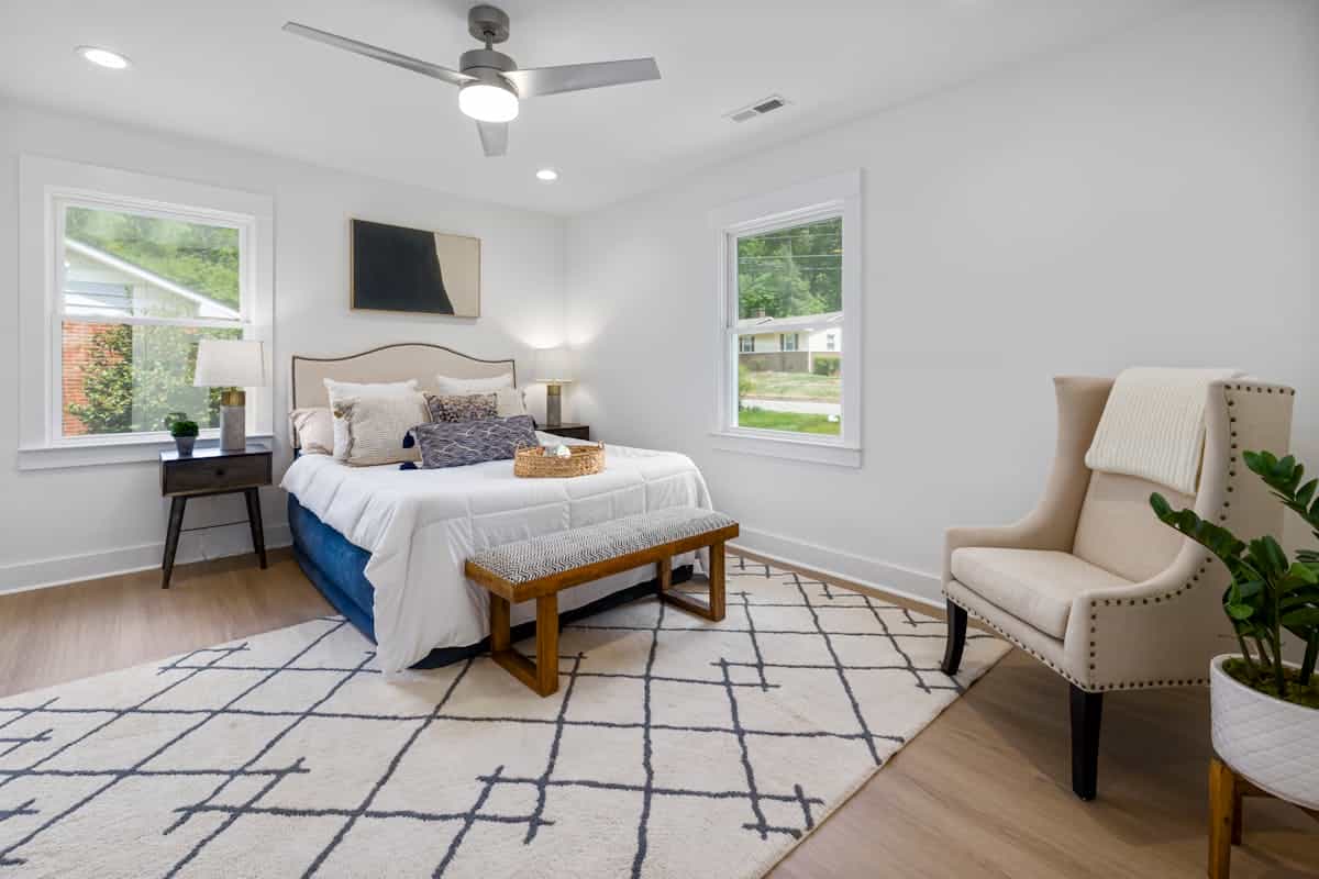 Contemporary bedroom with serene decor and natural light showing flexible bed placement, illustrating feng shui options