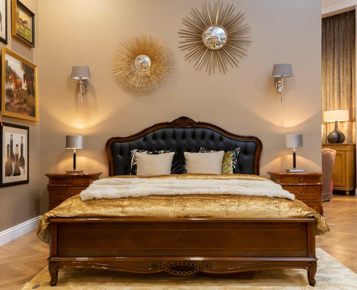 Elegant bedroom with a framed mirror above the headboard illustrating how to hang a mirror above the bed safely