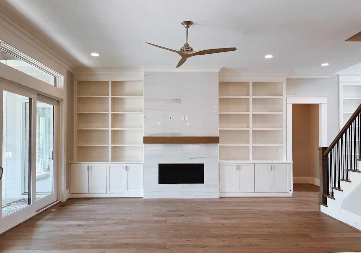 Living room with a fireplace feature wall illustrating fireplace and media accent wall ideas Living room with a fireplace and built-in shelving as a feature wall, illustrating a fireplace accent wall