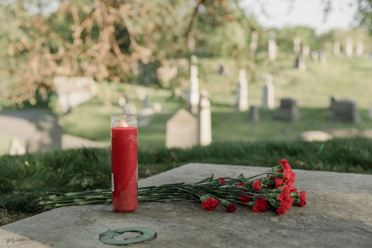 A serene cemetery memorial scene representing grief and comfort after losing a loved one